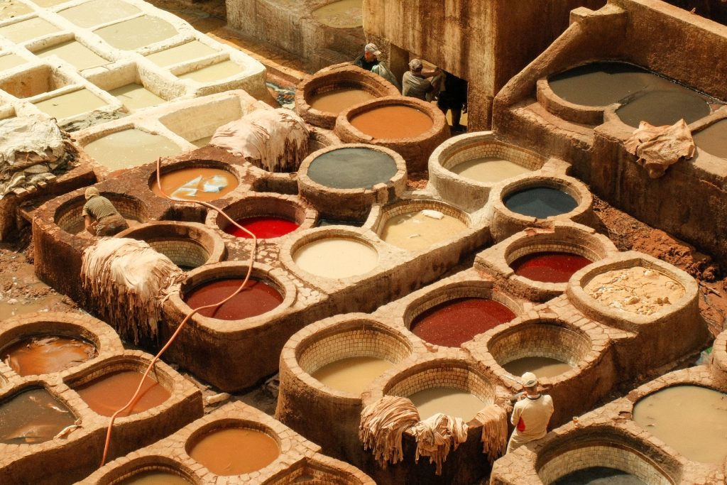 Colorful dye vats at tanneries showcasing traditional leather dyeing techniques.